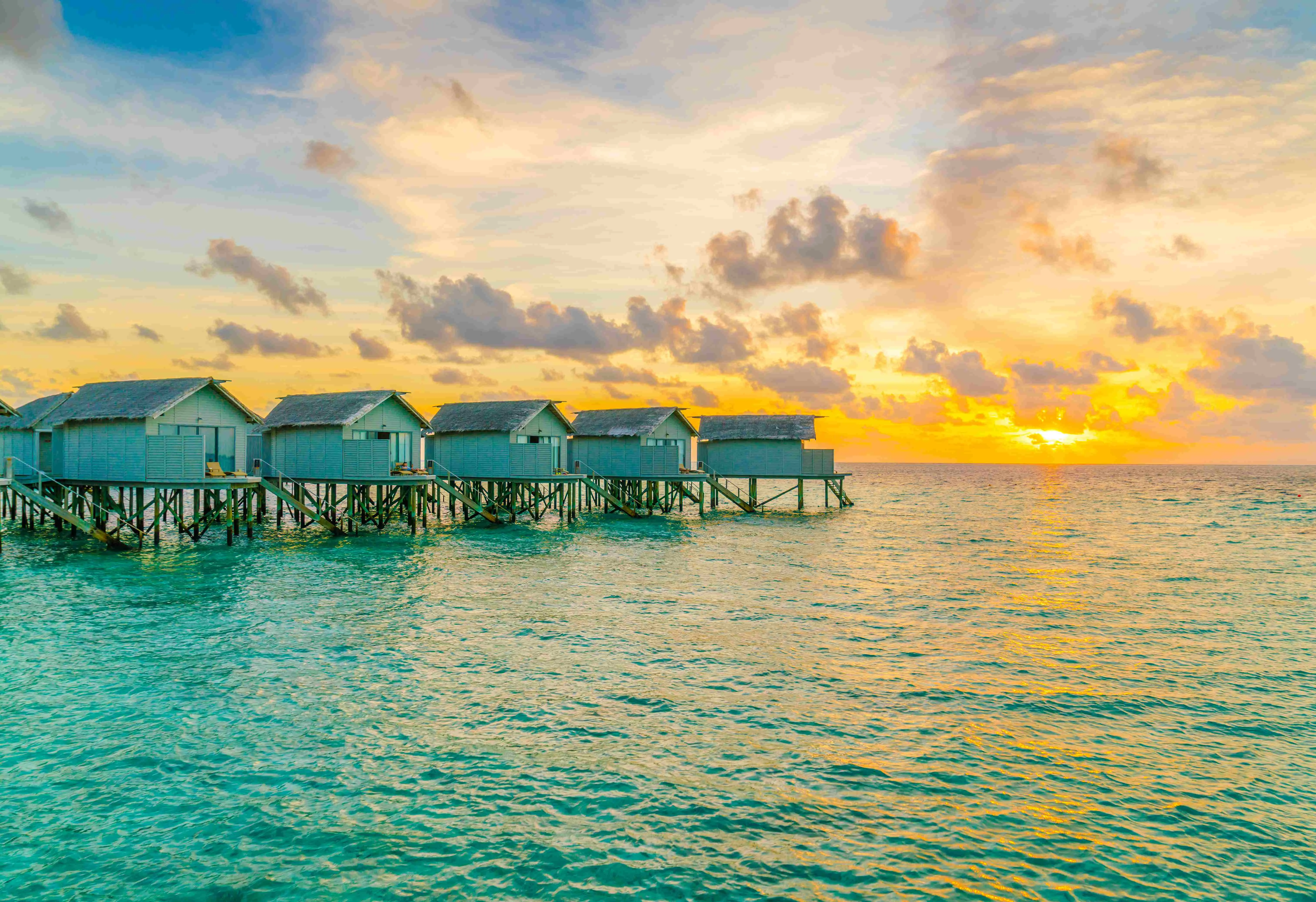 beautiful-water-villas-tropical-maldives-island-sunset-time_11zon (2).webp